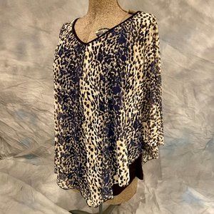 Layered, Top.  V-neck, poncho style outer layer